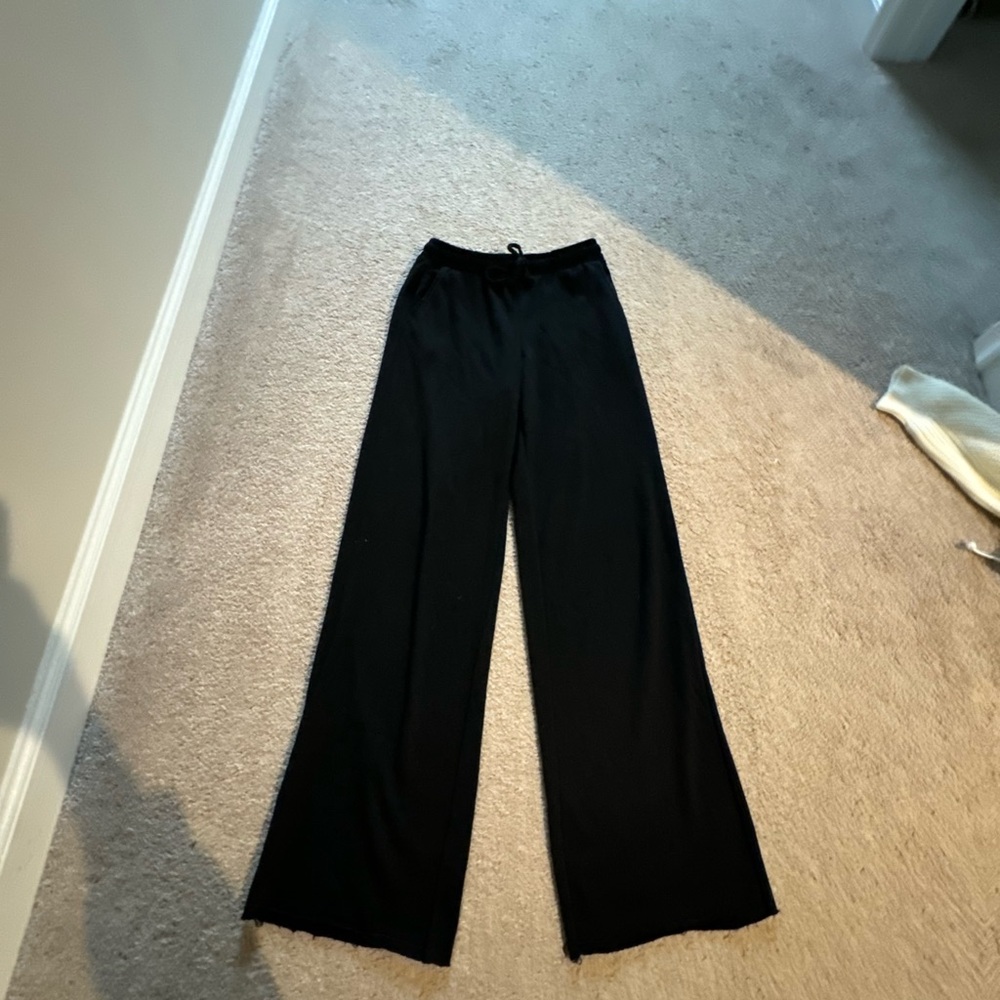 Black sweatpants gently worn flex on inside